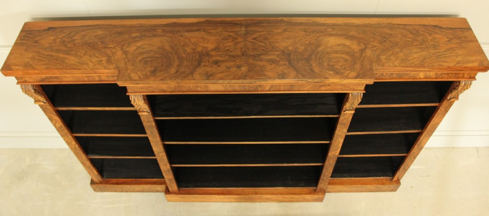 A large Victorian breakfront burr walnut open bookcase.  View VII