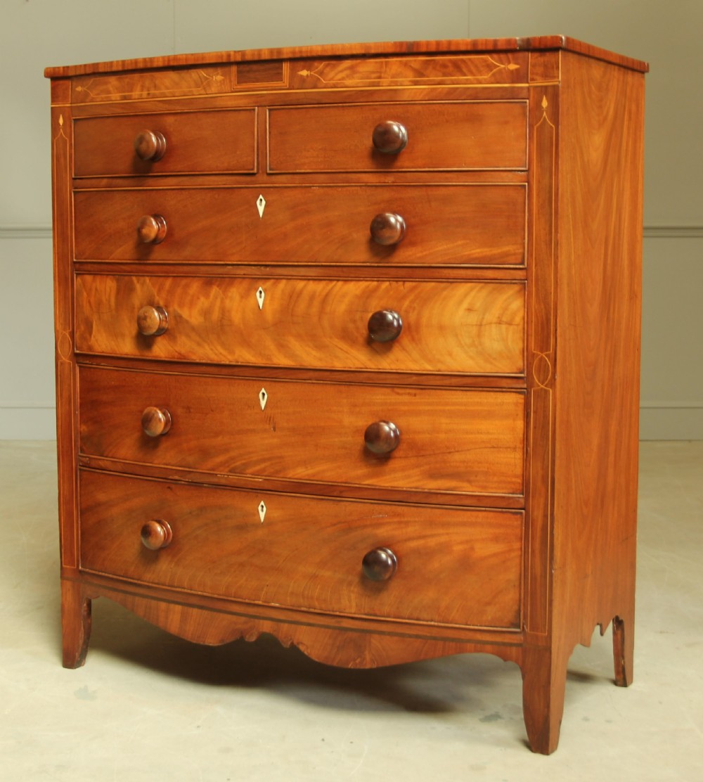 A VICTORIAN MAHOGANY BOW FRONTED CHEST OF DRAWERS. View III