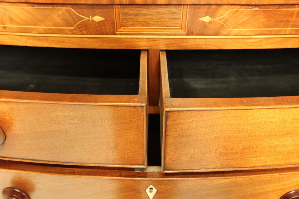 A VICTORIAN MAHOGANY BOW FRONTED CHEST OF DRAWERS. View IX