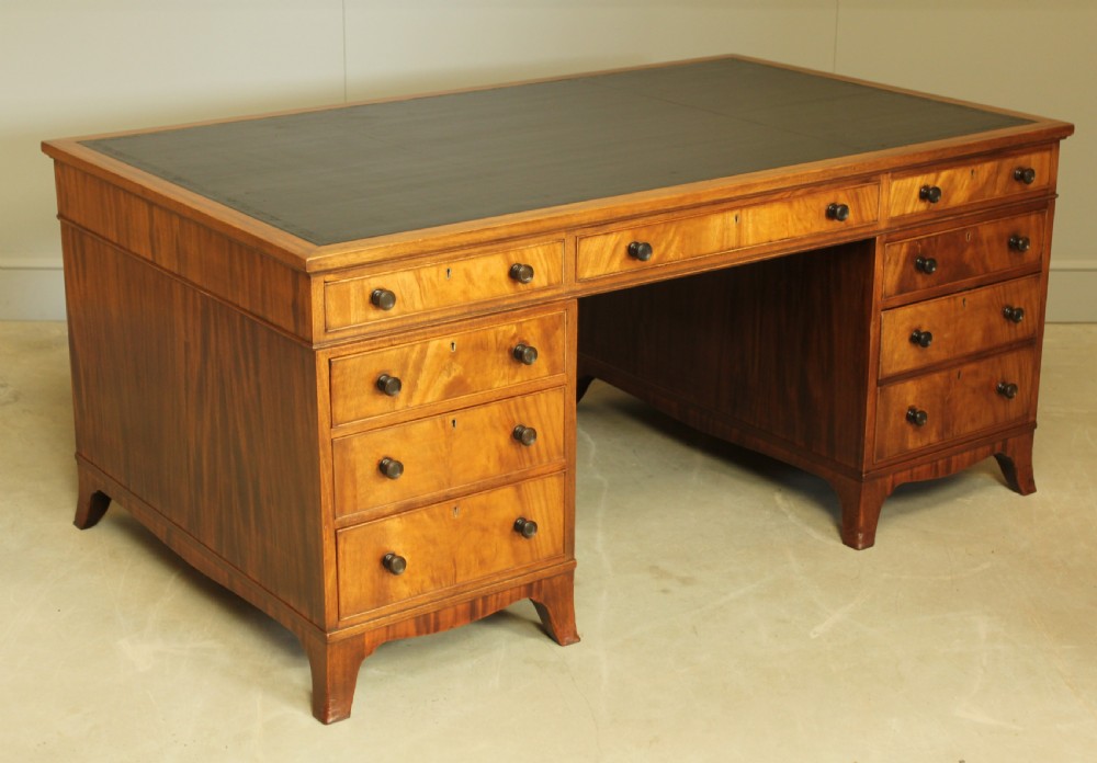 AN EARLY 20TH CENTURY CURL MAHOGANY PARTNERS DESK. View IV