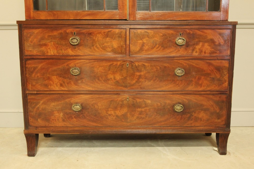 A 19TH CENTURY MAHOGANY BOOKCASE DISPLAY ON CHEST. View VI