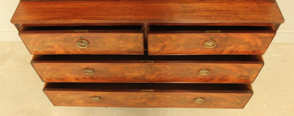 A 19TH CENTURY MAHOGANY BOOKCASE DISPLAY ON CHEST. View VII