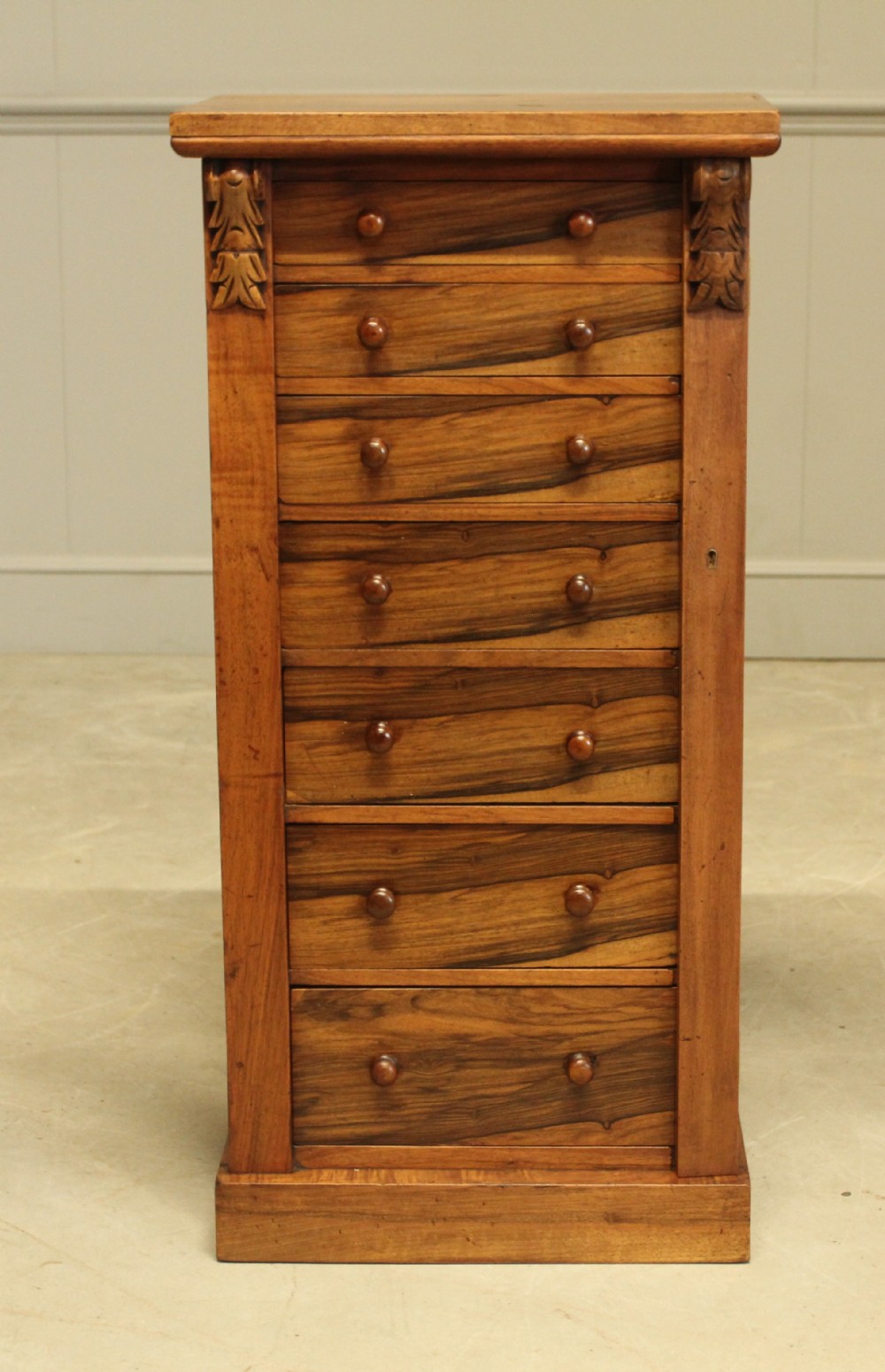 A VICTORIAN ROSEWOOD WELLINGTON CHEST