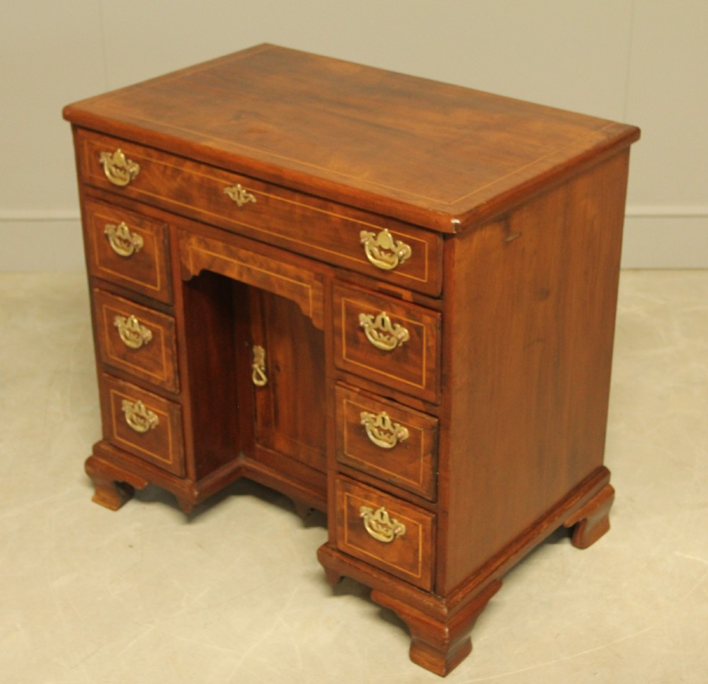 A Georgian walnut kneehole desk.  View VI