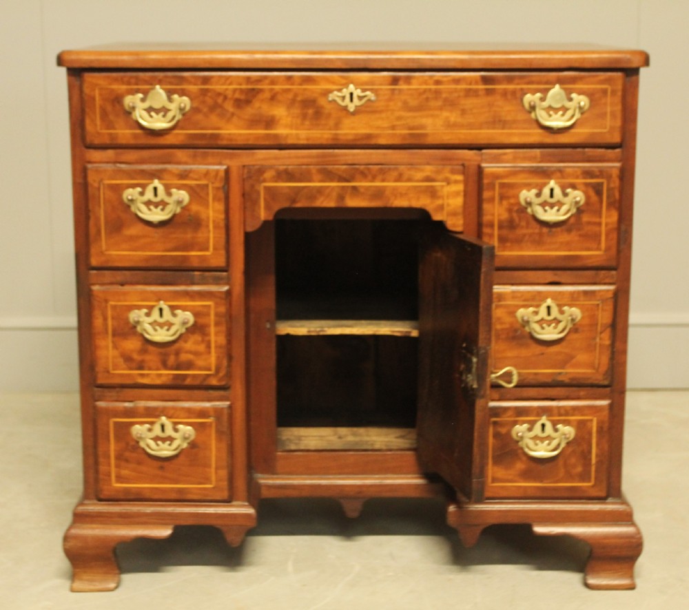 A Georgian walnut kneehole desk.  View VII
