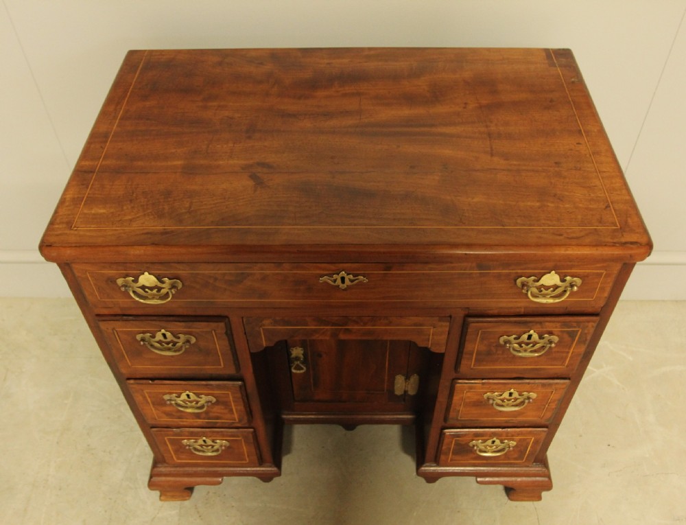 A Georgian walnut kneehole desk.  View VIII