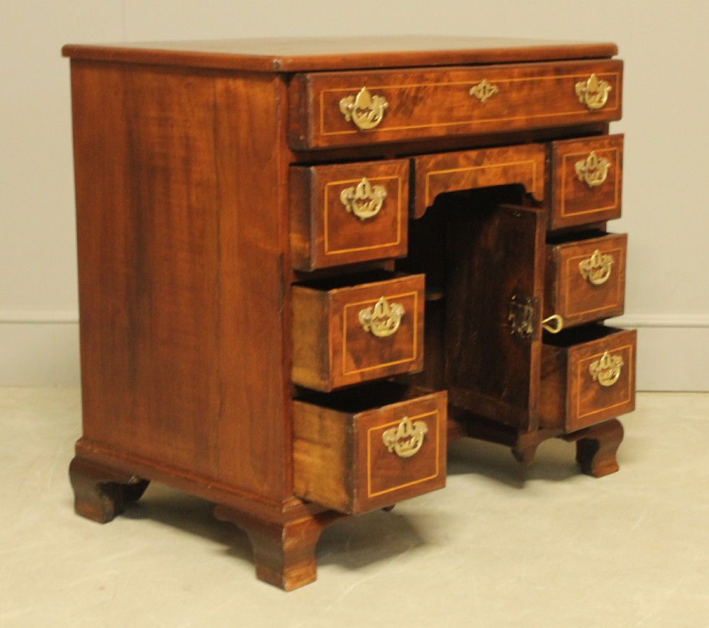 A Georgian walnut kneehole desk.  View IX