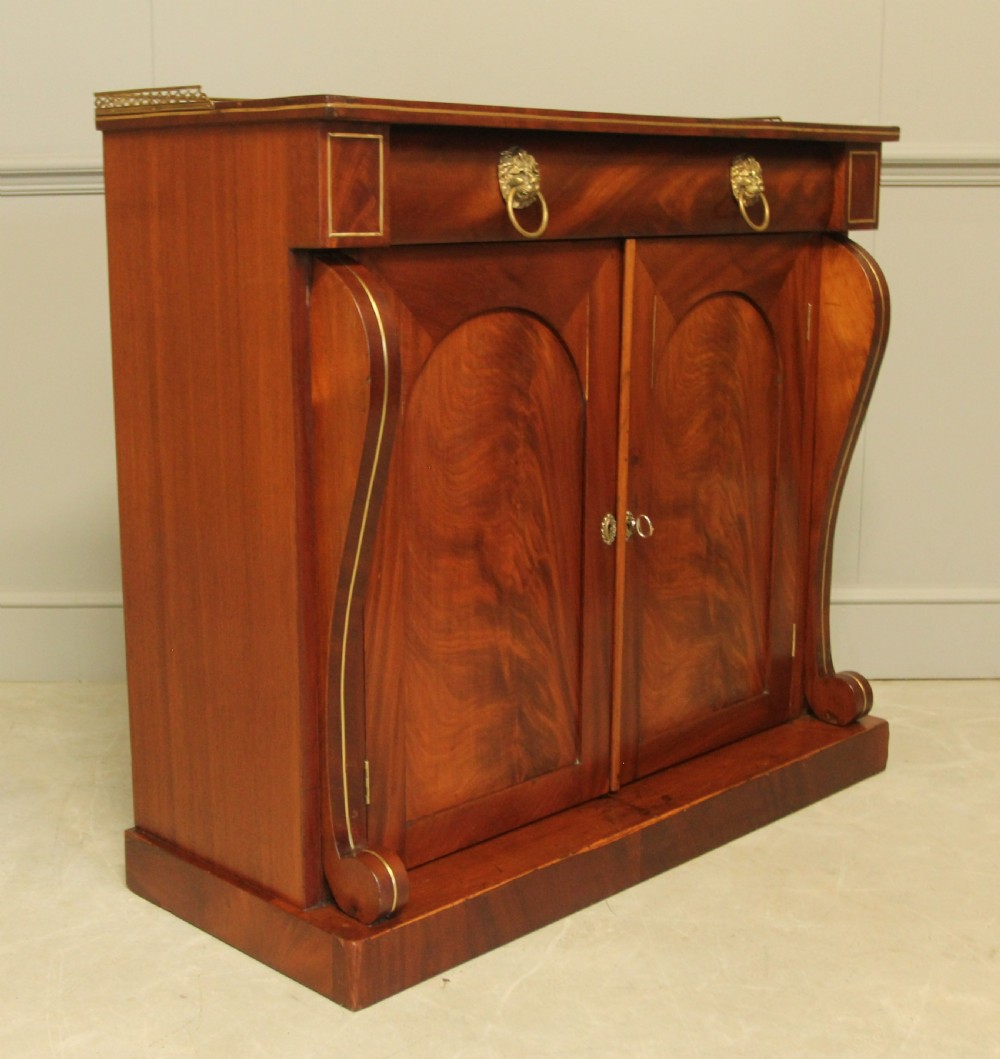 A Victorian two door brass inlaid sideboard.   View III