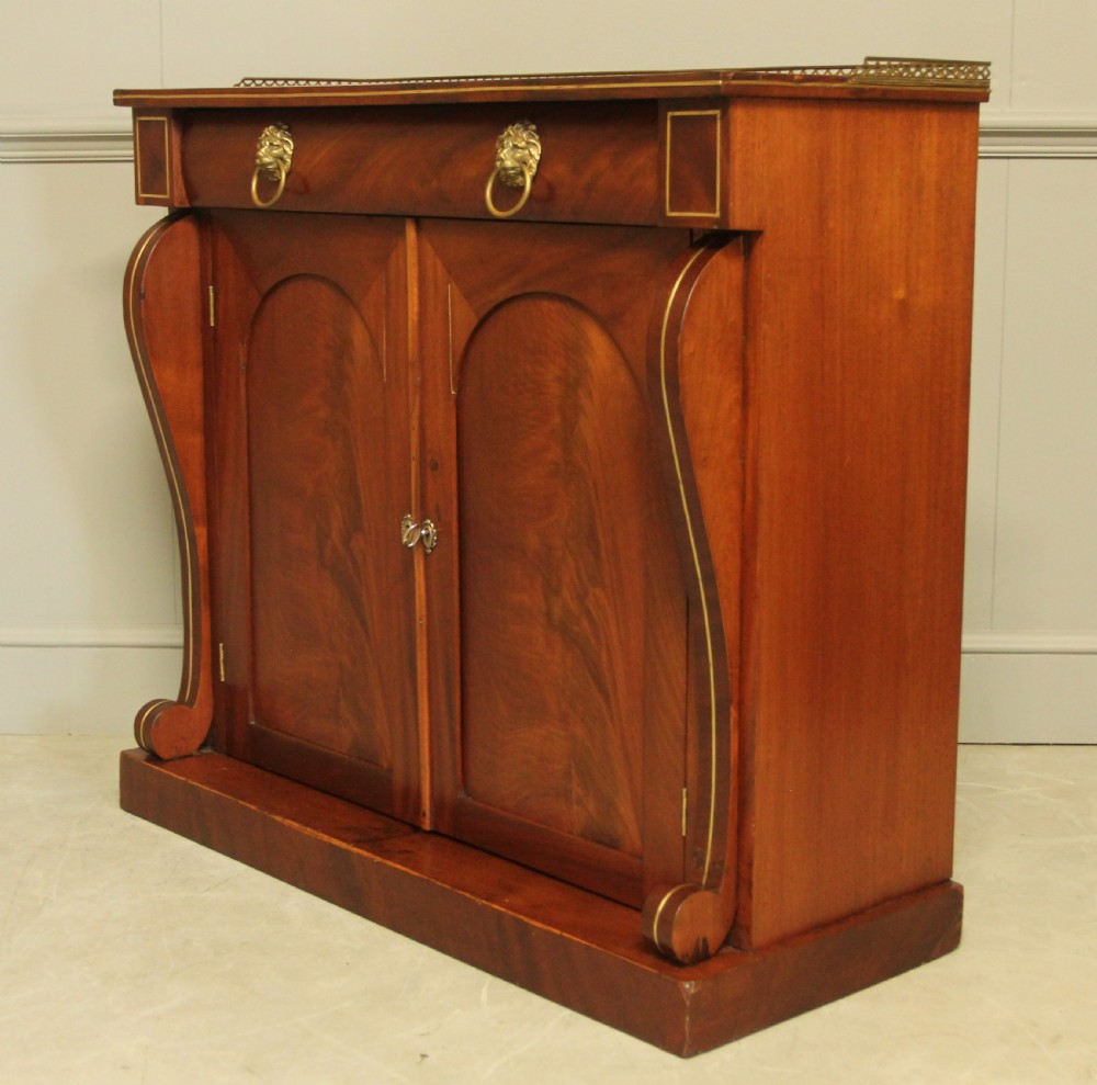 A Victorian two door brass inlaid sideboard.   View IV