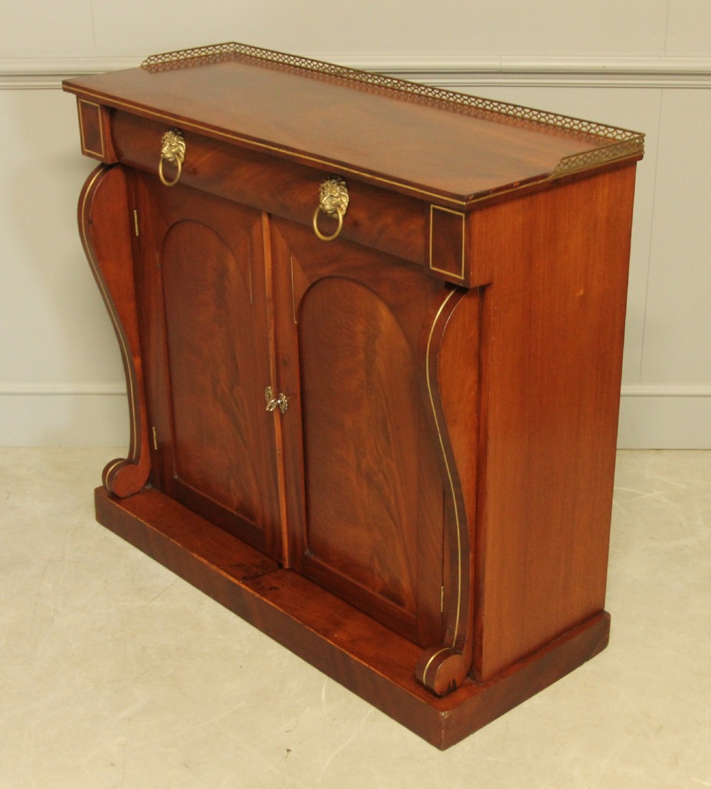 A Victorian two door brass inlaid sideboard.   View VI