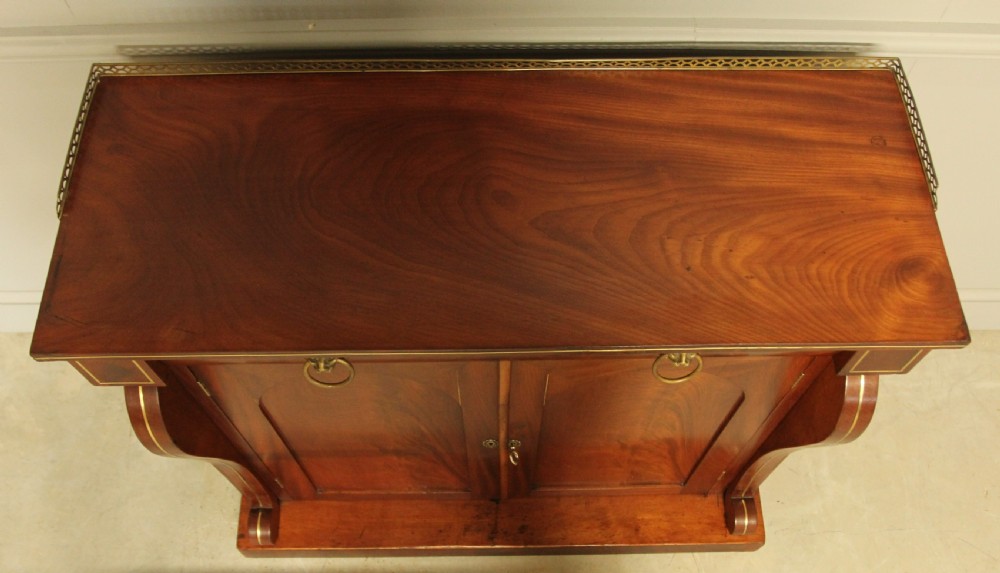A Victorian two door brass inlaid sideboard.   View VII