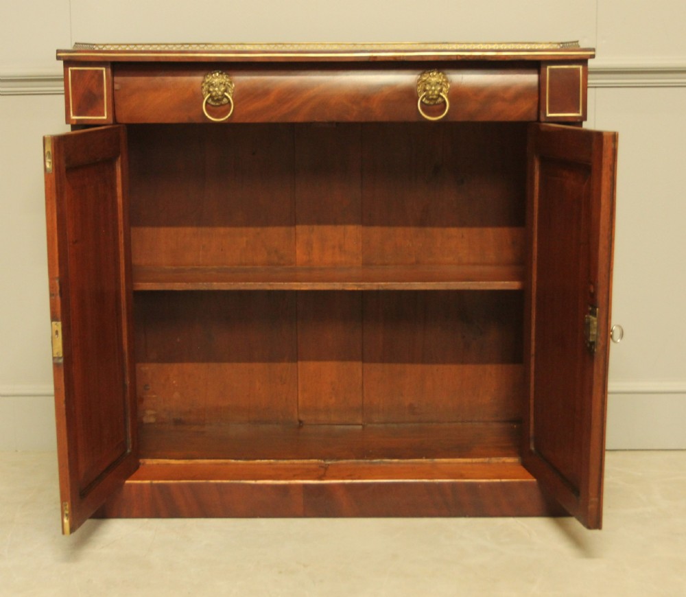 A Victorian two door brass inlaid sideboard.   View VIII