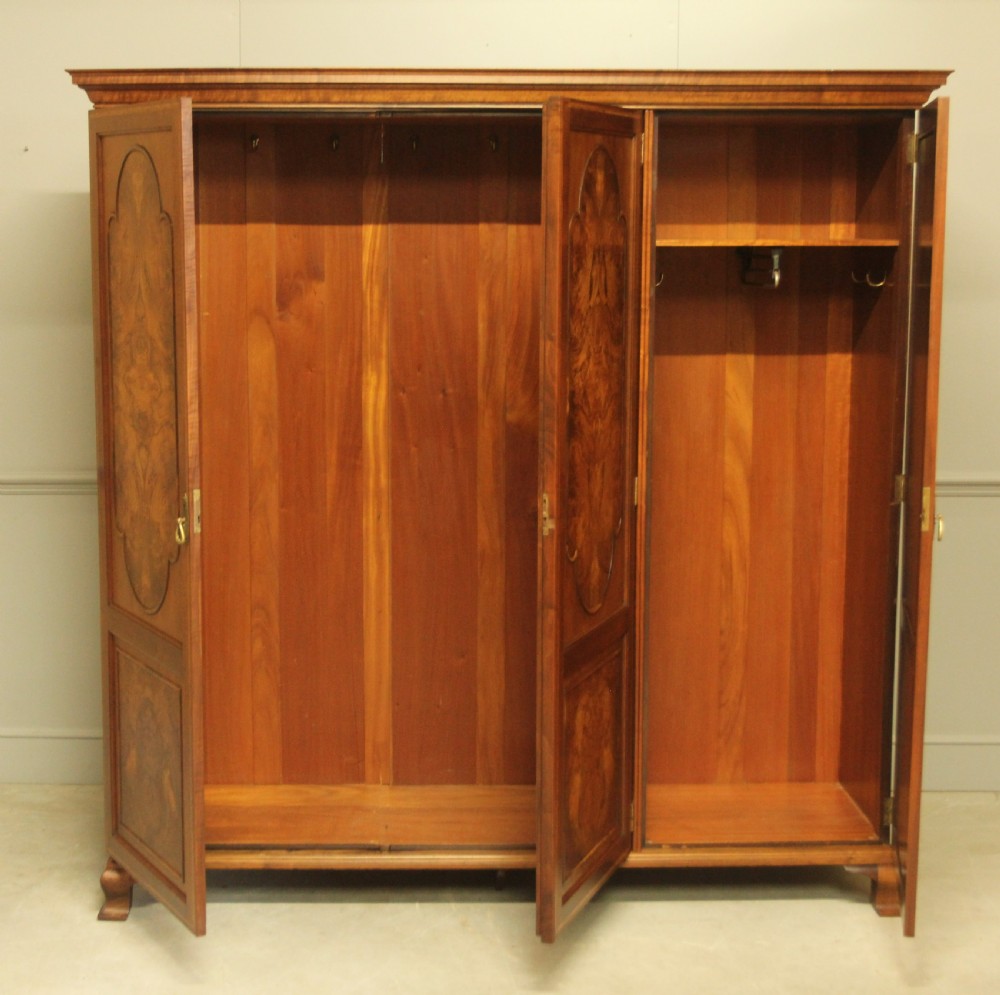 AN EARLY 20TH CENTURY BURR WALNUT TRIPLE WARDROBE.  View VIII