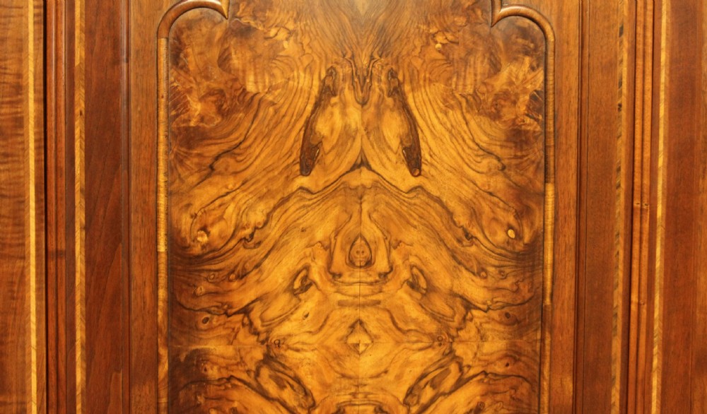 AN EARLY 20TH CENTURY BURR WALNUT TRIPLE WARDROBE.  View IX