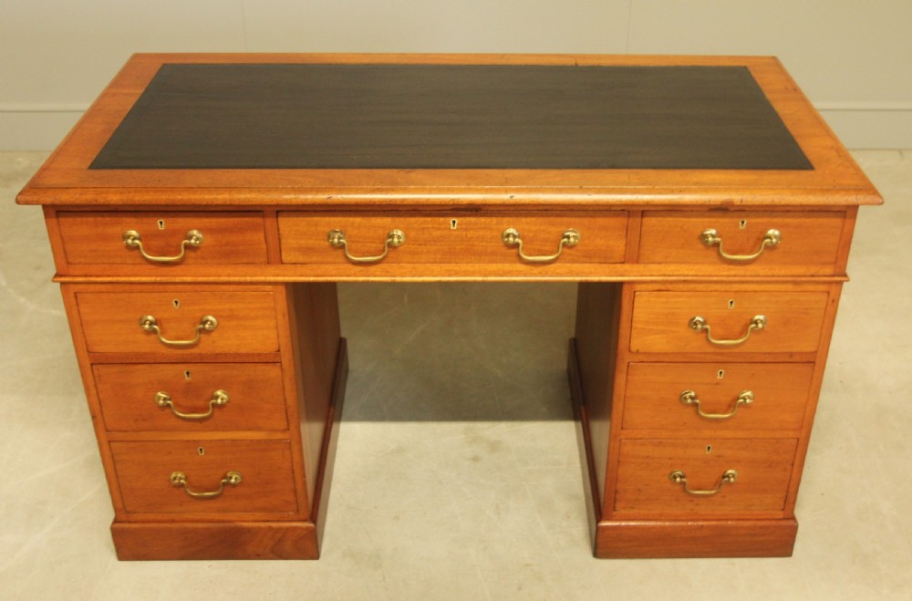 A Victorian mahogany twin pedestal desk.  View II