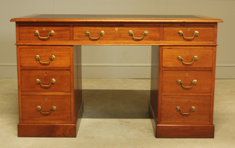A Victorian mahogany twin pedestal desk.  View III