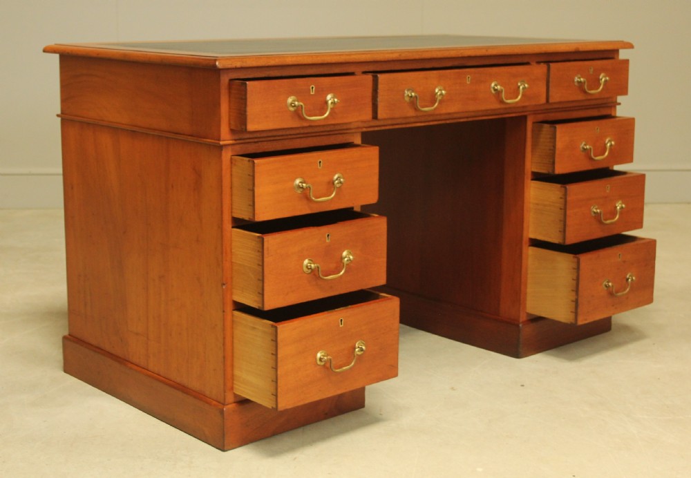 A Victorian mahogany twin pedestal desk.  View VIII