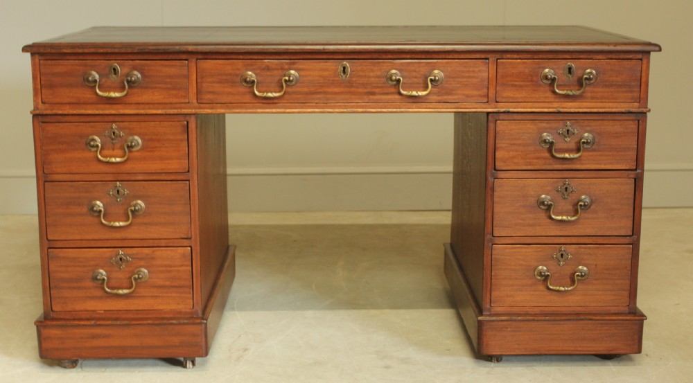A VICTORIAN MAHOGANY TWIN PEDESTAL DESK