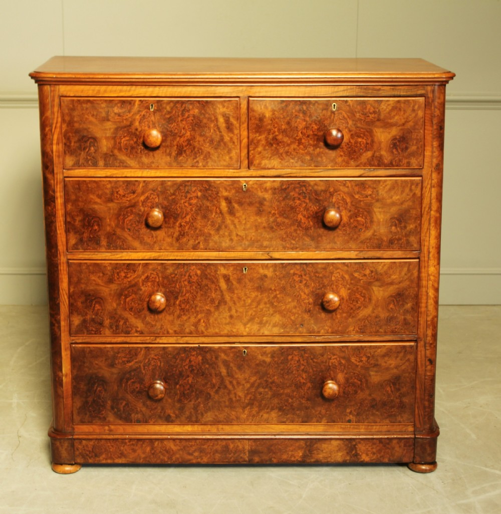 A VICTORIAN BURR WALNUT CHEST OF DRAWERS. View II