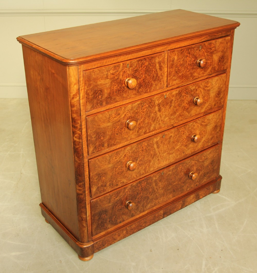 A VICTORIAN BURR WALNUT CHEST OF DRAWERS. View IV