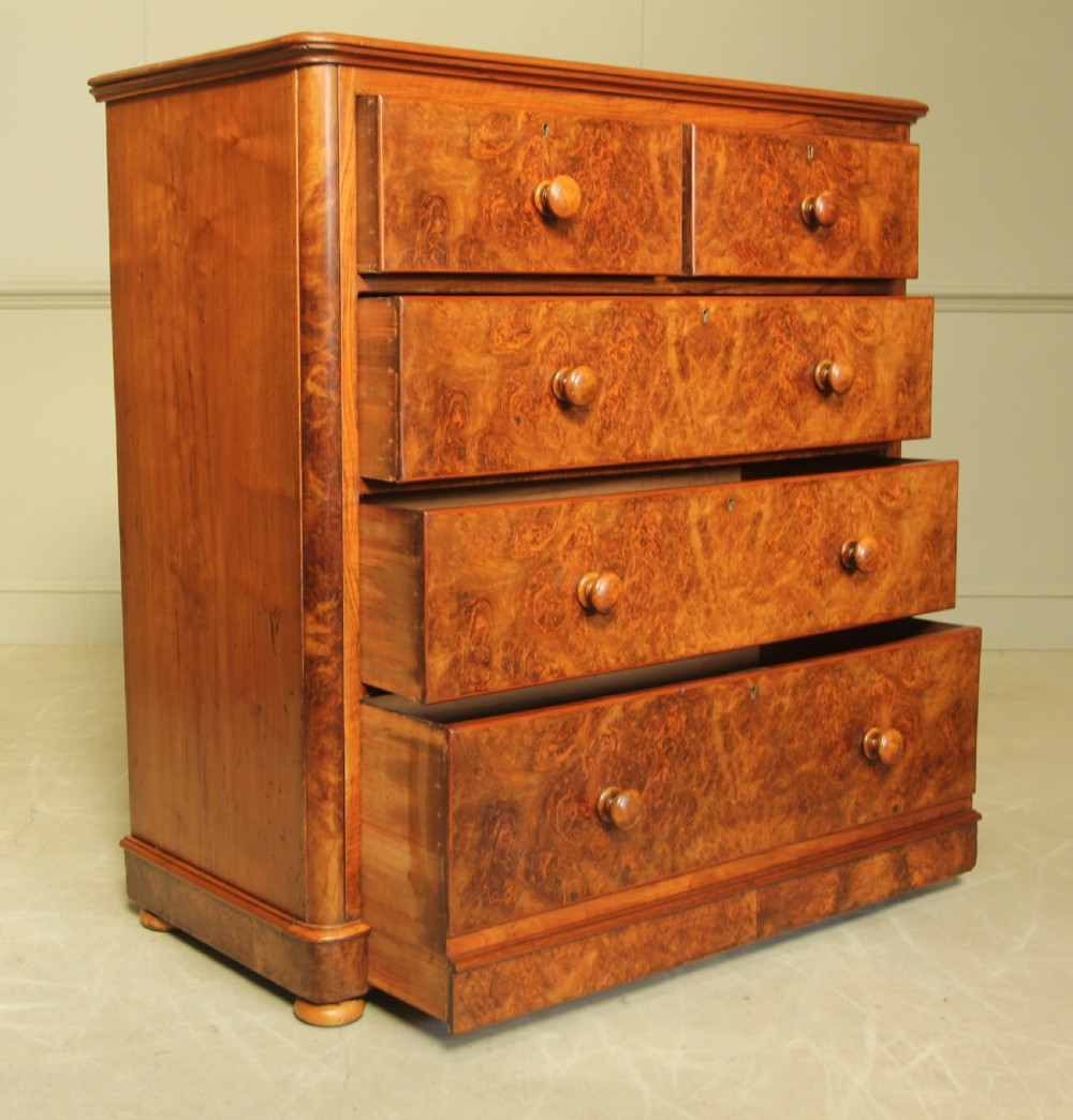 A VICTORIAN BURR WALNUT CHEST OF DRAWERS. View V