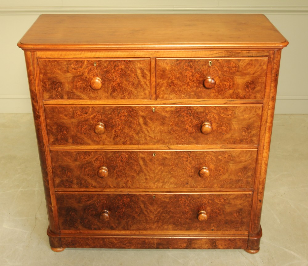 A VICTORIAN BURR WALNUT CHEST OF DRAWERS. View VII