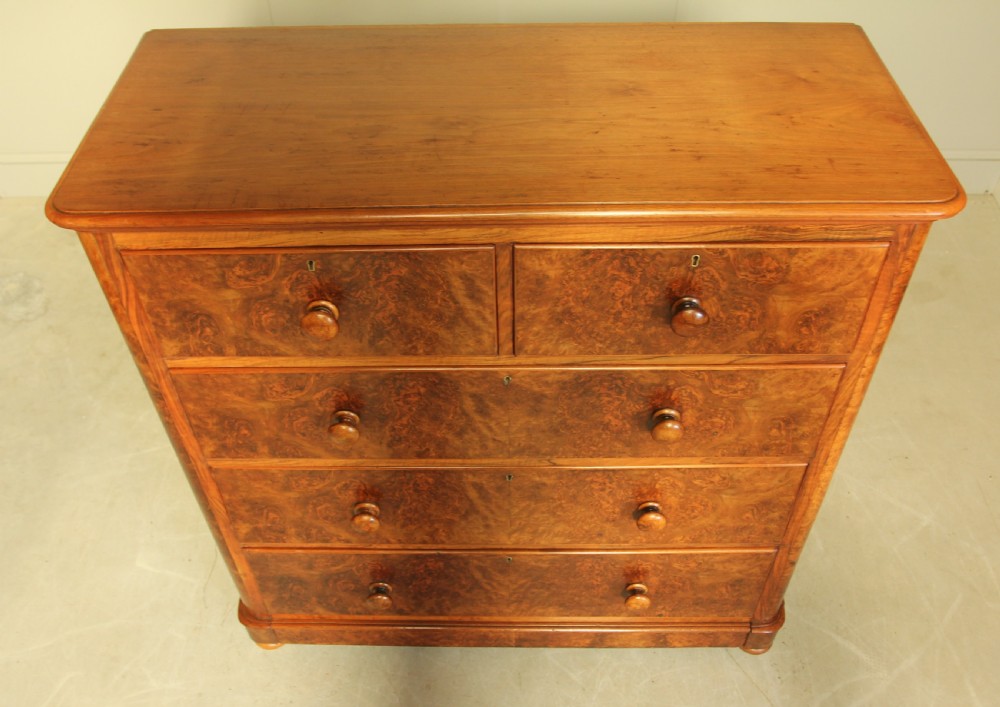 A VICTORIAN BURR WALNUT CHEST OF DRAWERS. View VIII