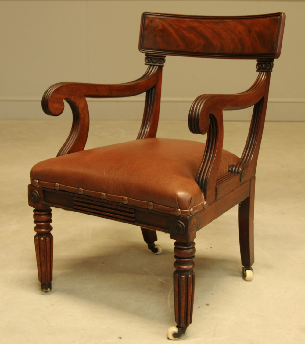 A WILLIAM IV MAHOGANY BAR BACK ARMCHAIR
