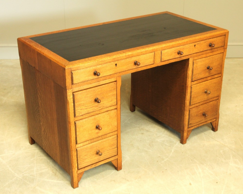 AN EARLY 20TH CENTURY HEALS STYLE OAK TWIN PEDISTAL DESK View III