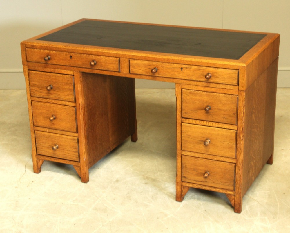 AN EARLY 20TH CENTURY HEALS STYLE OAK TWIN PEDISTAL DESK View IV