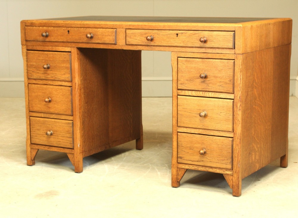 AN EARLY 20TH CENTURY HEALS STYLE OAK TWIN PEDISTAL DESK View VI