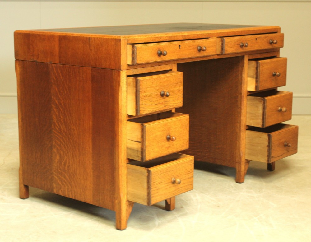 AN EARLY 20TH CENTURY HEALS STYLE OAK TWIN PEDISTAL DESK View VIII