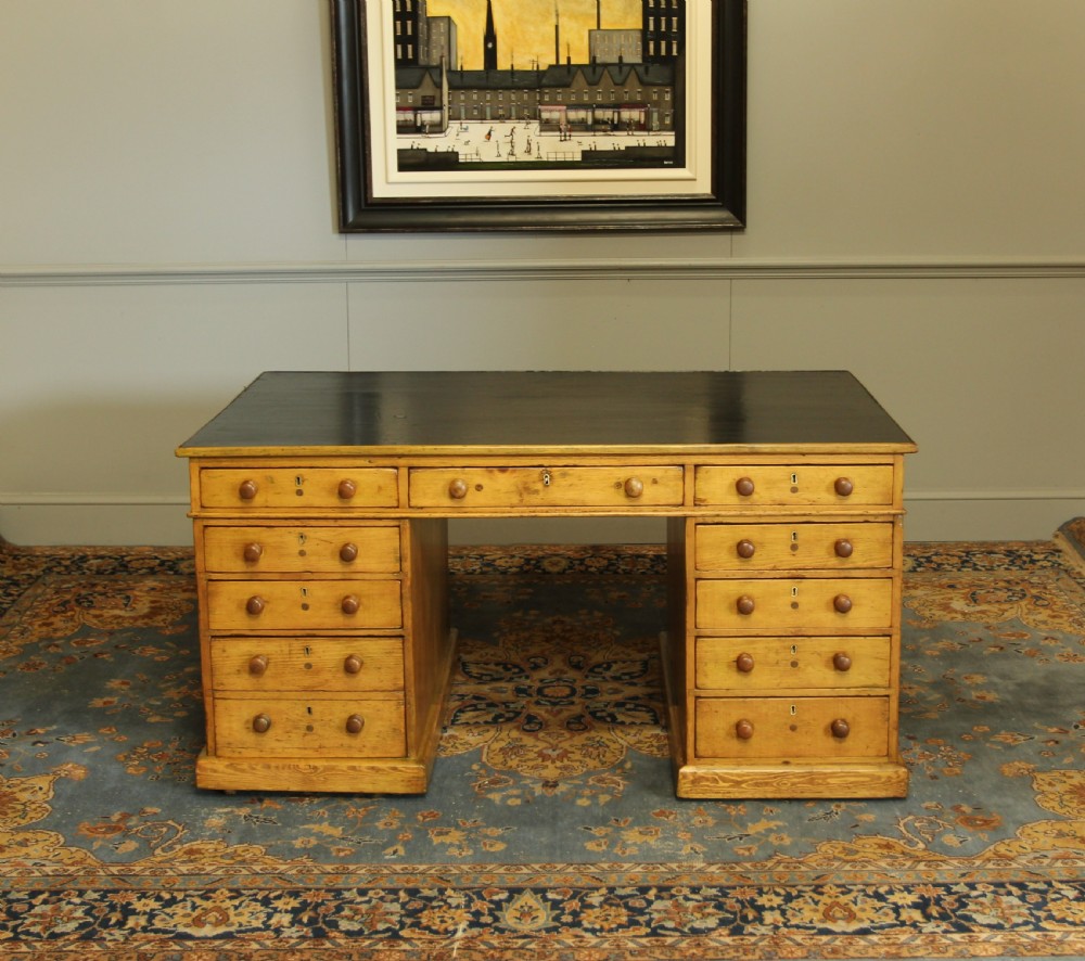 A 19TH CENTURY PITCH PINE PARTNERS DESK
