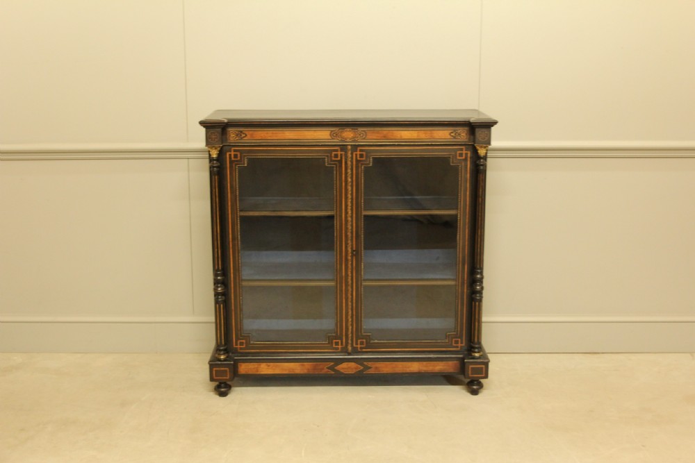 A Victorian Ebonized two door bookcase display  View III