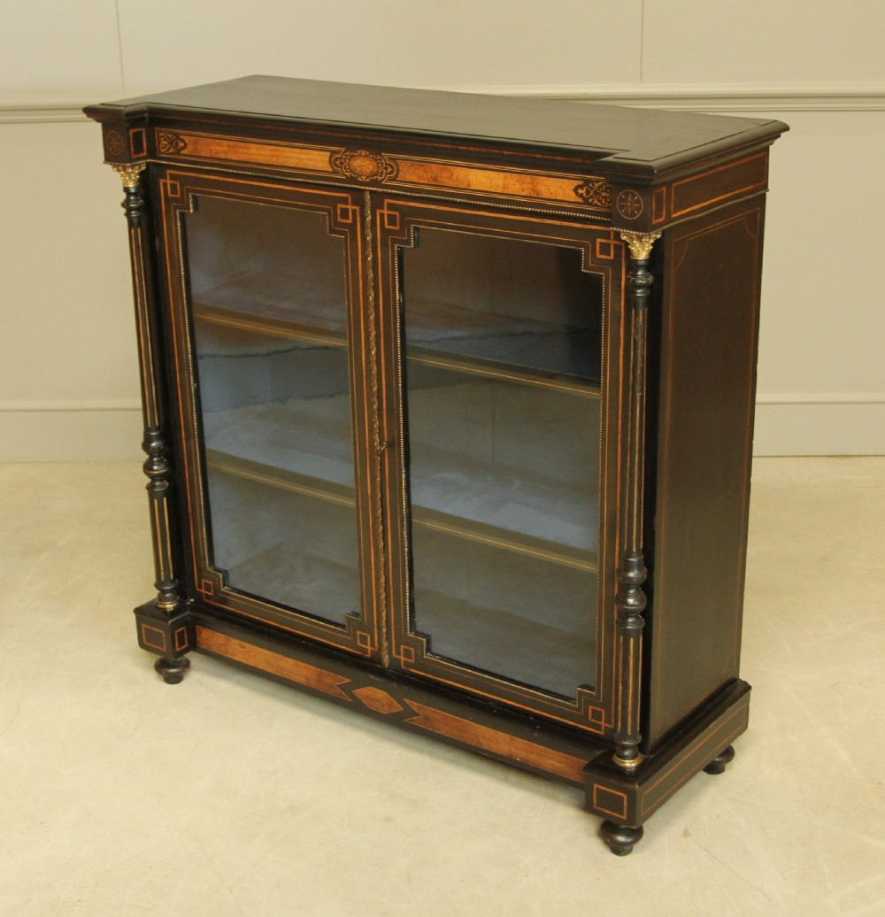 A Victorian Ebonized two door bookcase display  View IV