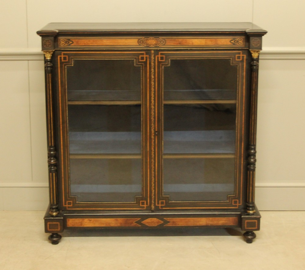 A Victorian Ebonized two door bookcase display  View V