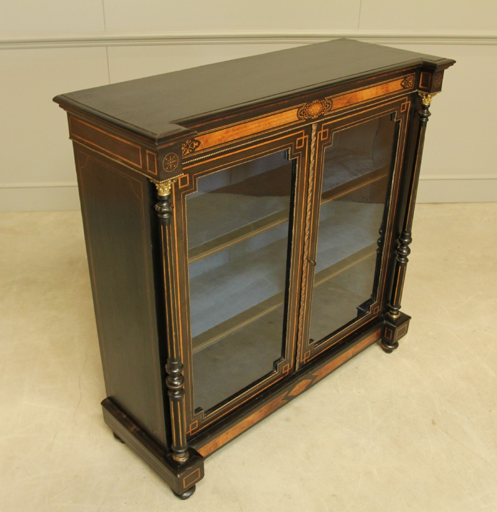 A Victorian Ebonized two door bookcase display  View VI