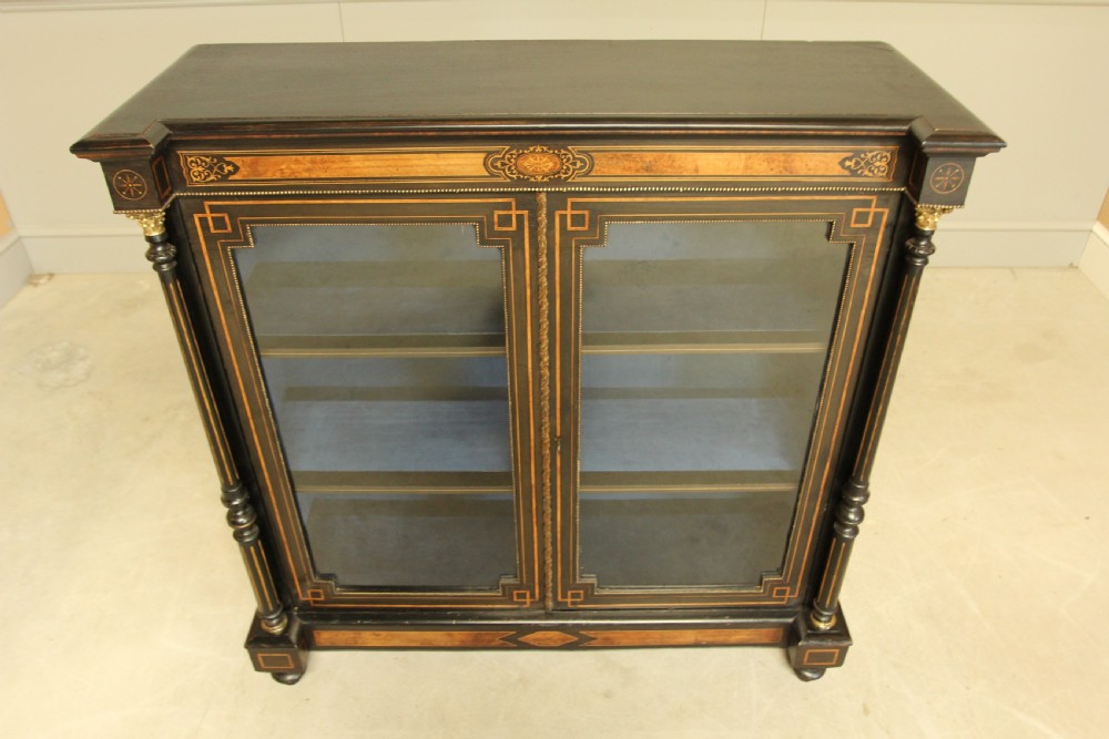 A Victorian Ebonized two door bookcase display  View VIII