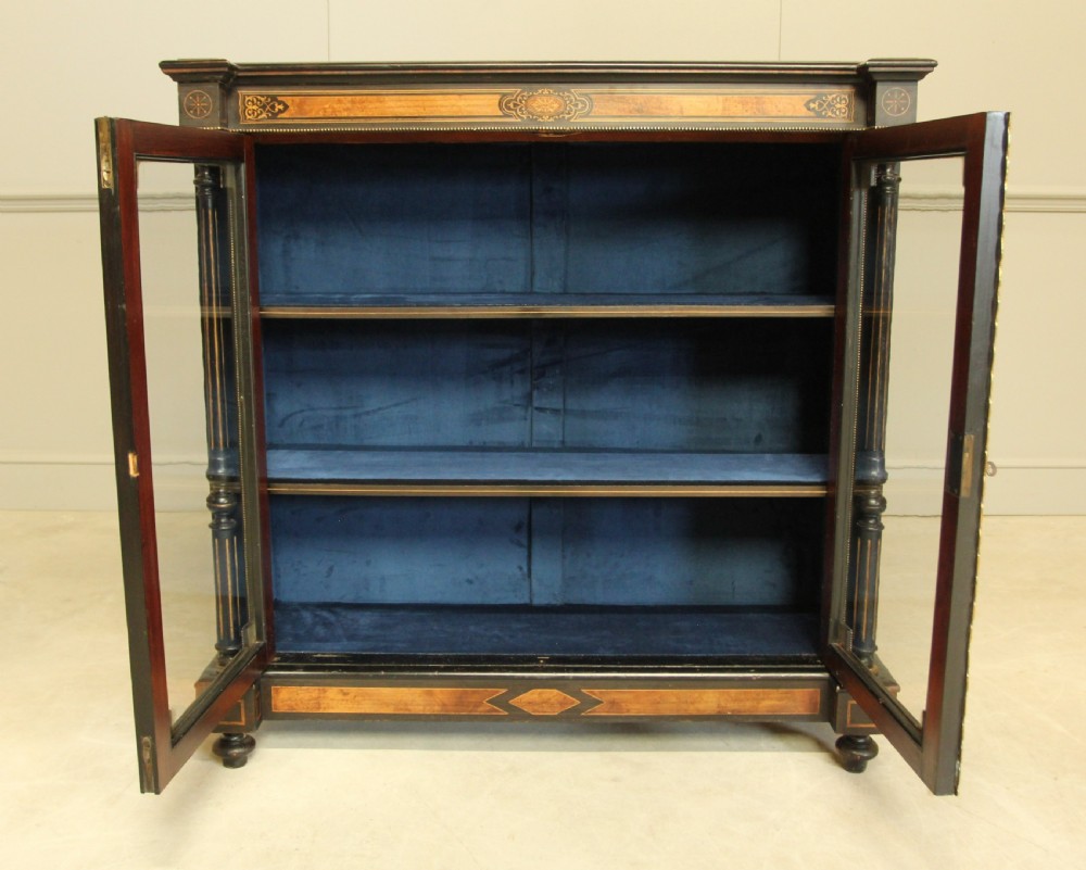 A Victorian Ebonized two door bookcase display  View IX