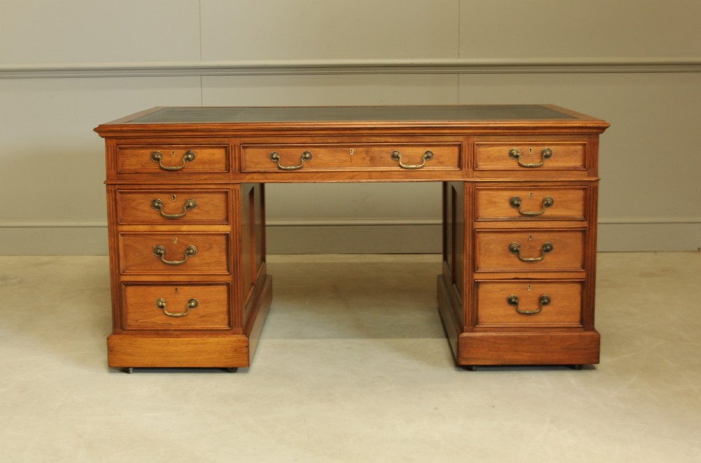 An early 20th century walnut twin pedestal writing desk. 