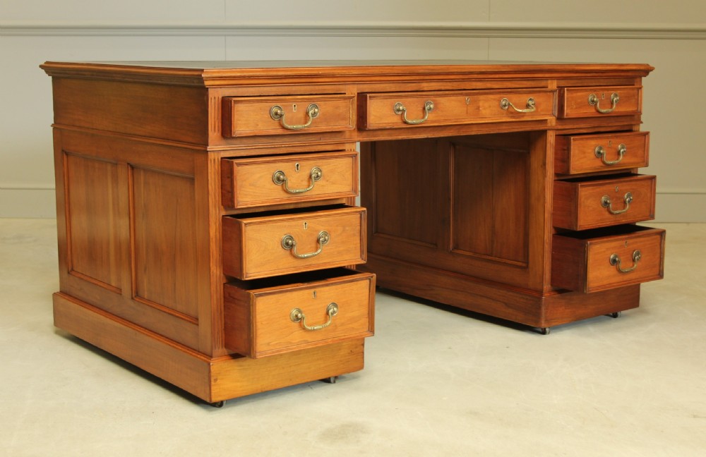 An early 20th century walnut twin pedestal writing desk.  View V