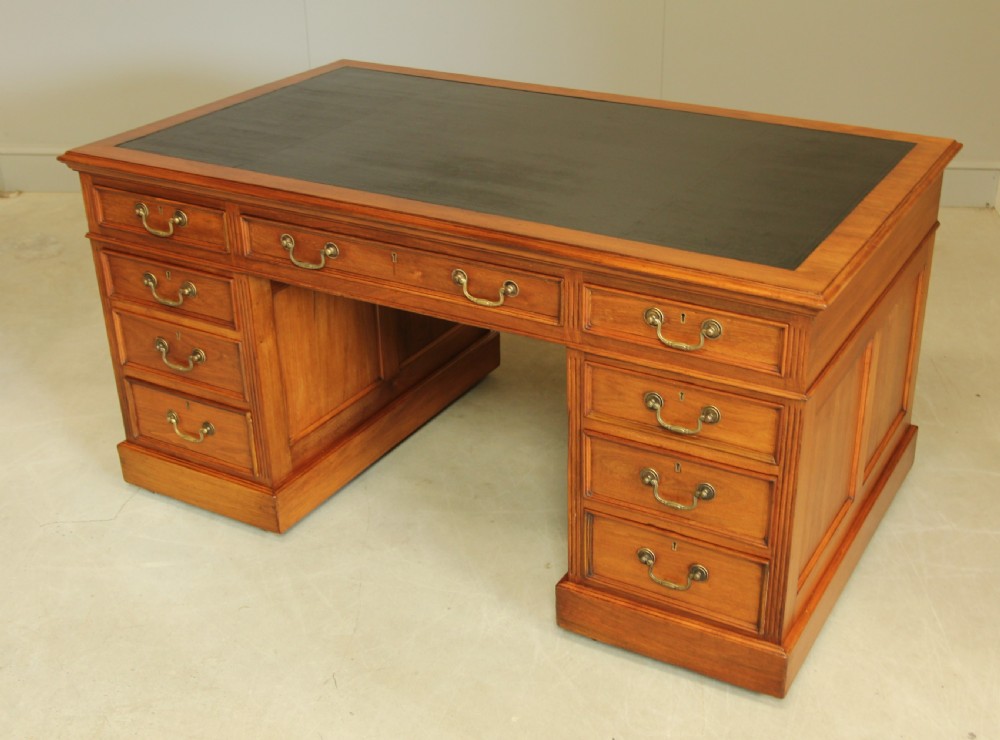 An early 20th century walnut twin pedestal writing desk.  View VII
