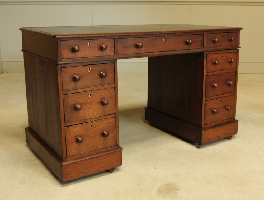 A 19th century Victorian oak twin pedestal writing desk. View VII