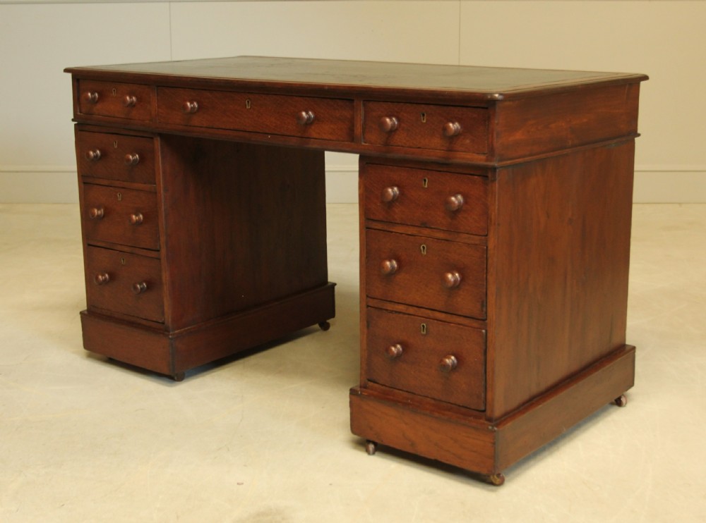 A 19th century Victorian oak twin pedestal writing desk. View IX