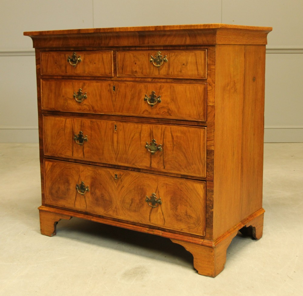 A 19th century Walnut chest of drawers. View IX