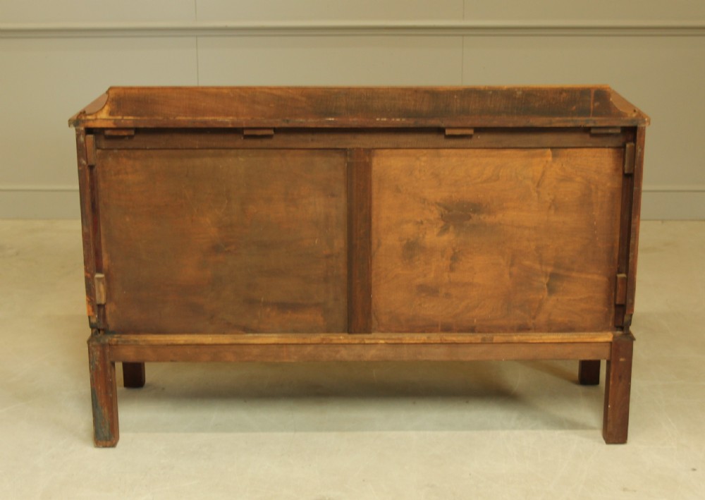 An early 20th century curl mahogany serpentine sideboard. View X