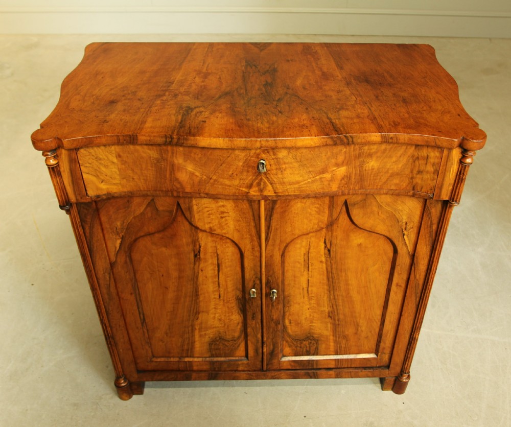 A Serpentine 19th century French Walnut two door sideboard. View III
