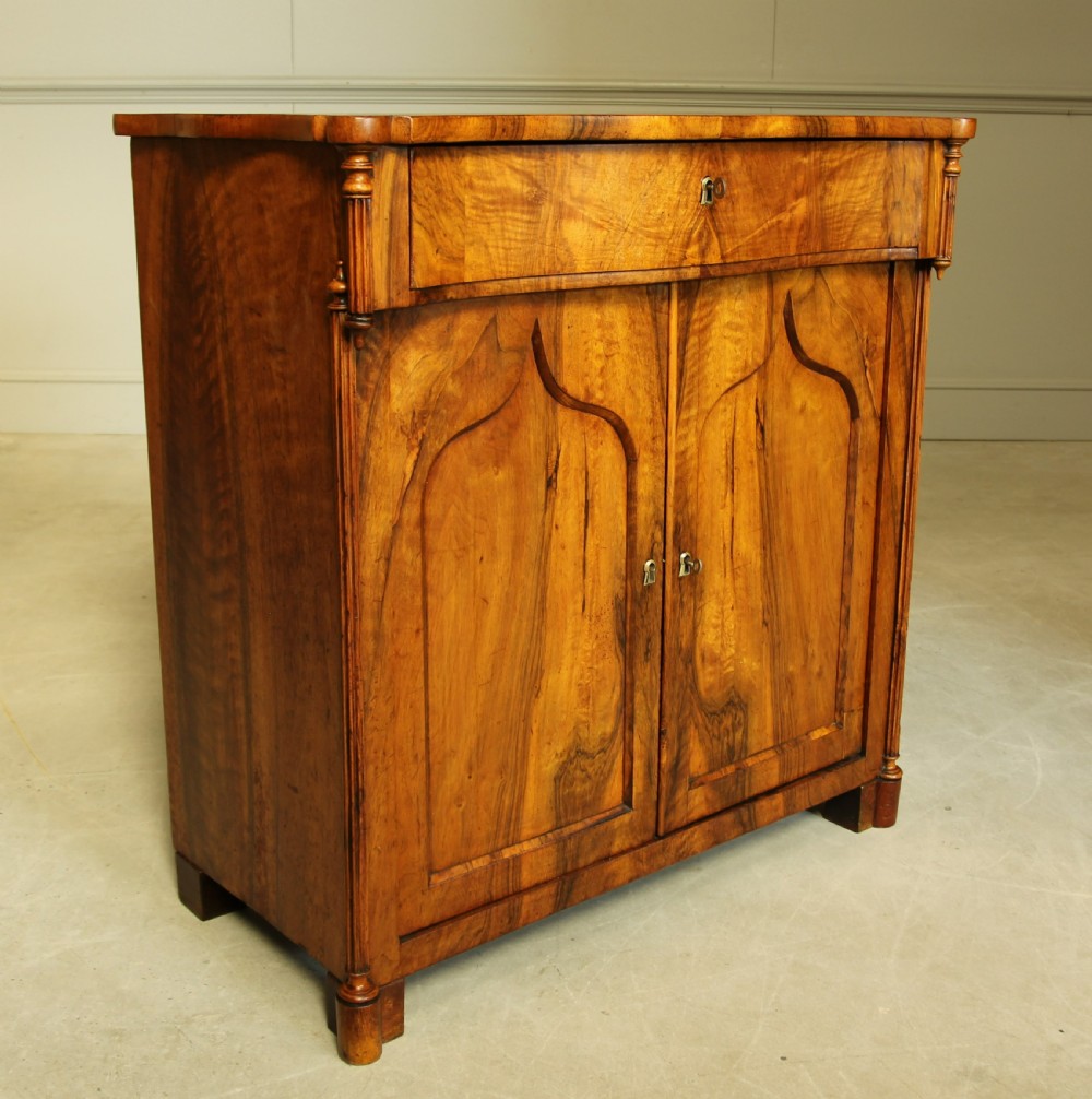 A Serpentine 19th century French Walnut two door sideboard. View IV