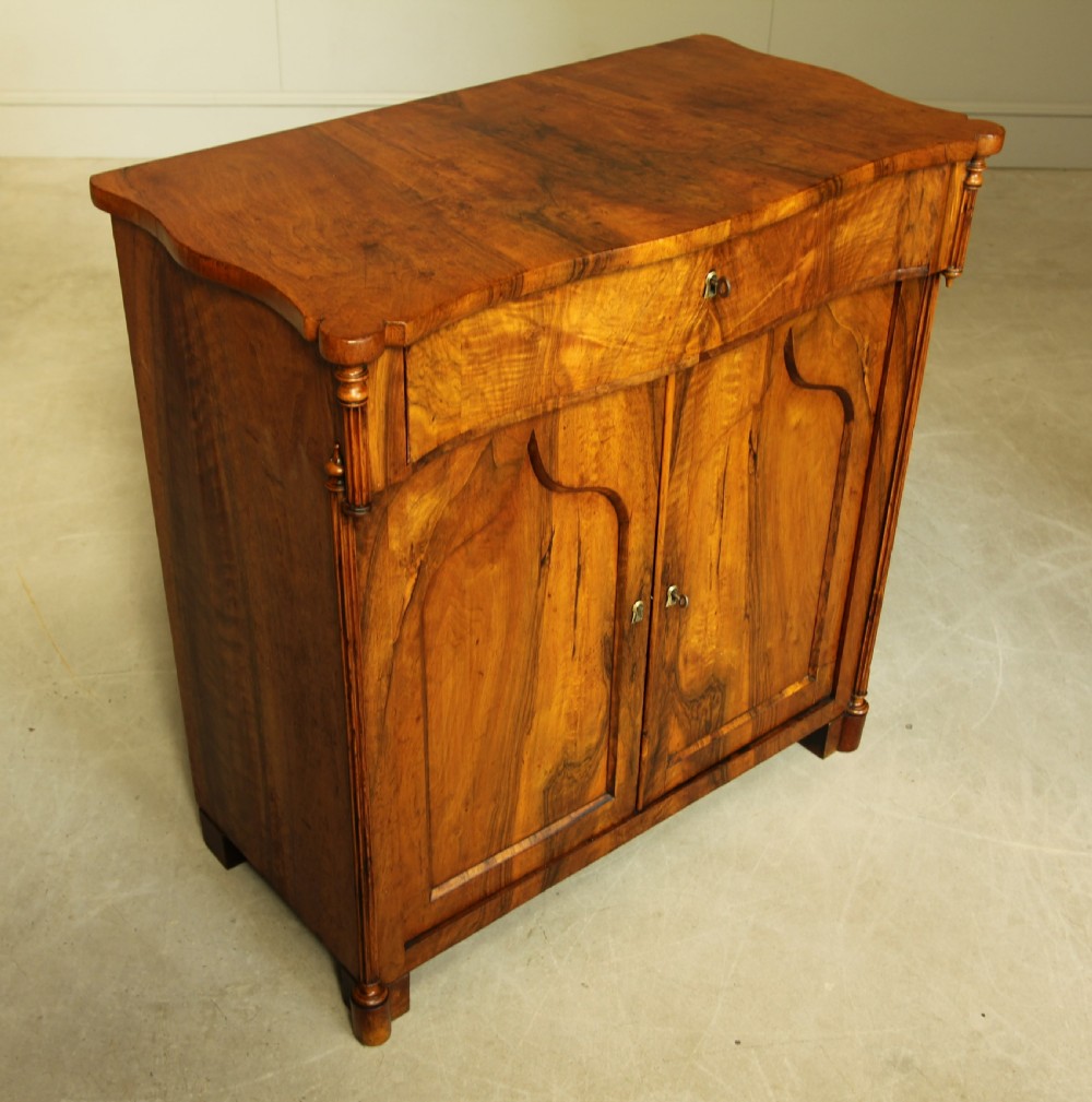 A Serpentine 19th century French Walnut two door sideboard. View VI