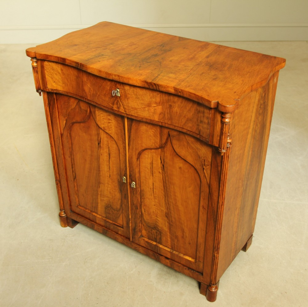 A Serpentine 19th century French Walnut two door sideboard. View VII